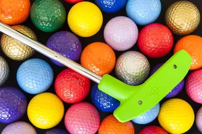 golf club mixed in colorful golf balls 