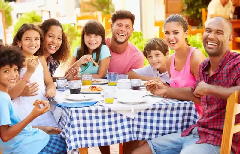 Two families sharing a meal at one of the restaurants near our Pigeon Forge condos for rent.