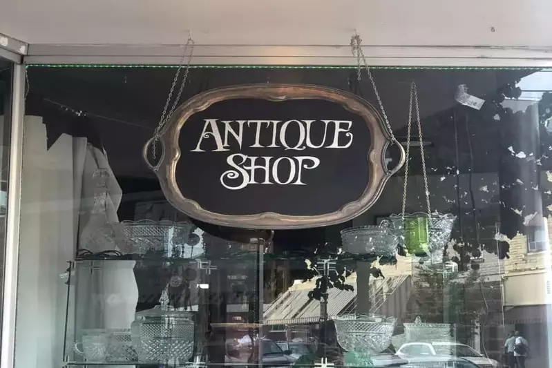 antique store sign in window