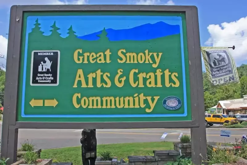 green sign for the great smoky arts and crafts community