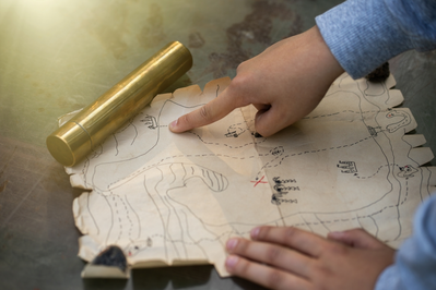 pirate map with child's hand